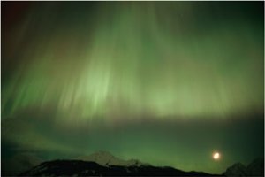 The aurora borealis illuminates the sky